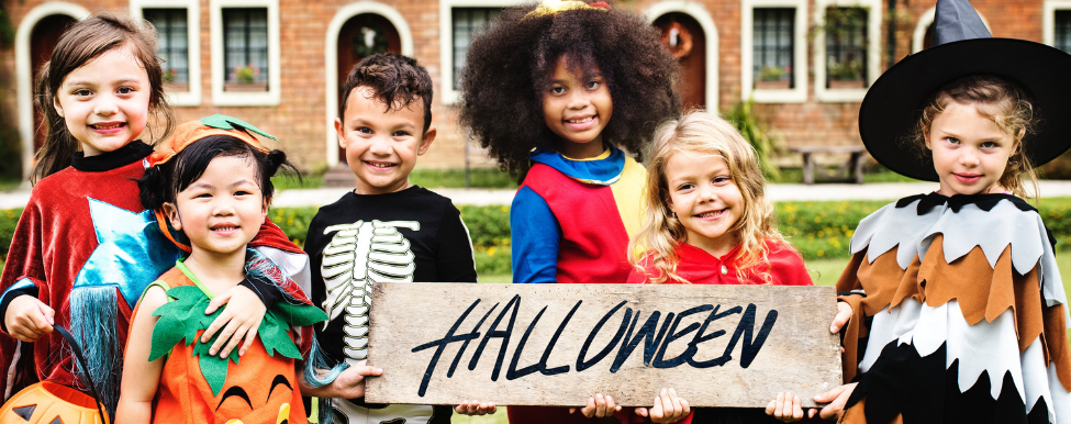 Kids handing Halloween sign