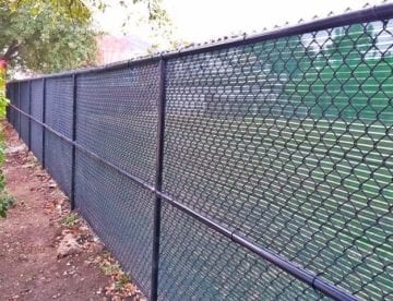 Black Chain Link Fence with Green Windscreen